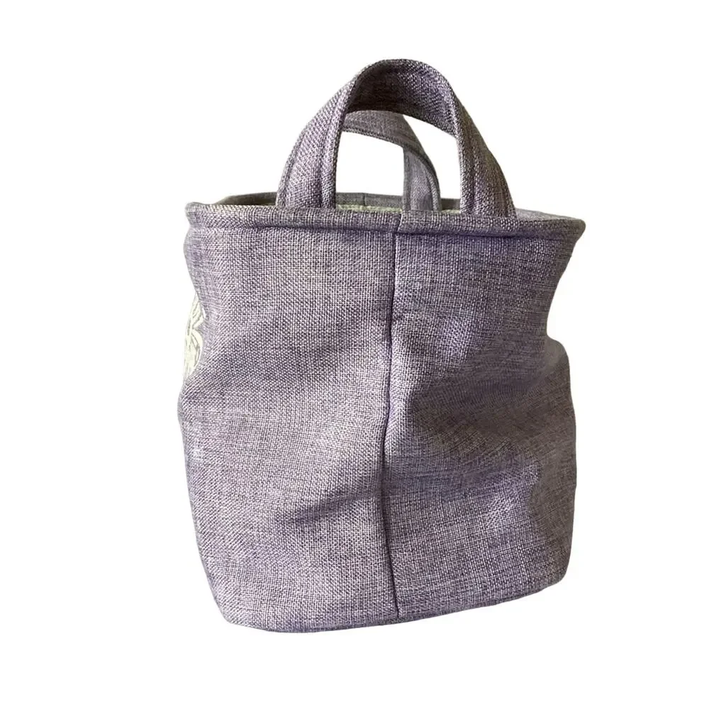 Lavender cloth basket with floral accents